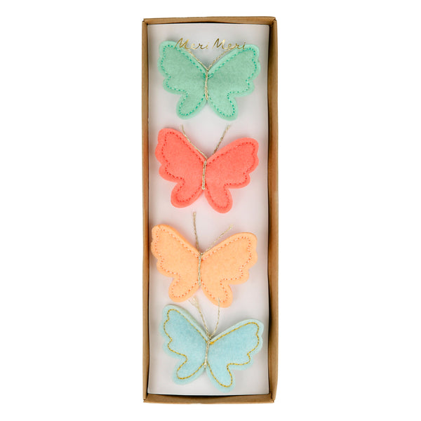 Our butterfly hair accessories are beautifully crafted from colorful felt with sweet metallic gold antennae.