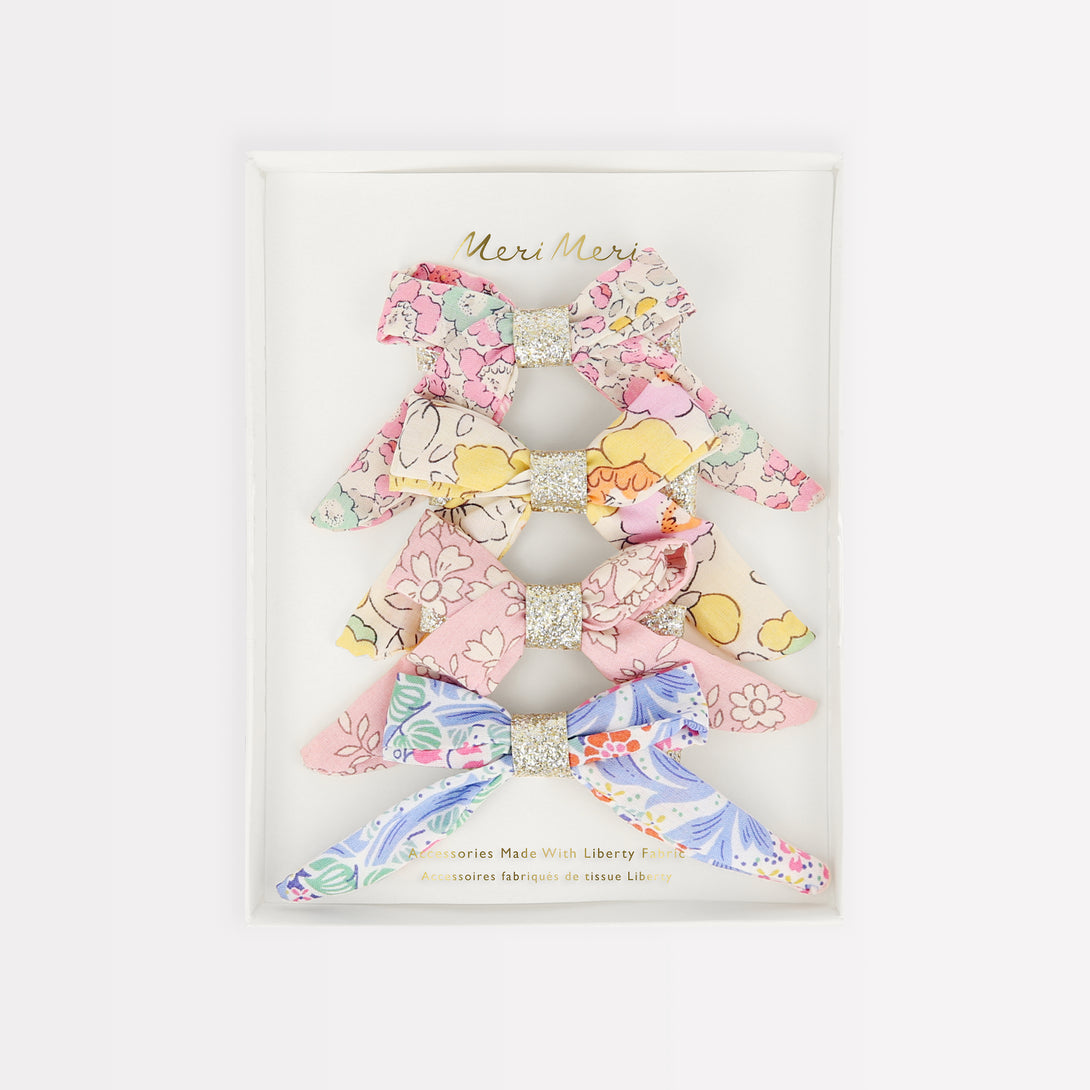 Bows are beautiful, and look amazing on these hair clips as they're crafted with Liberty floral fabric.
