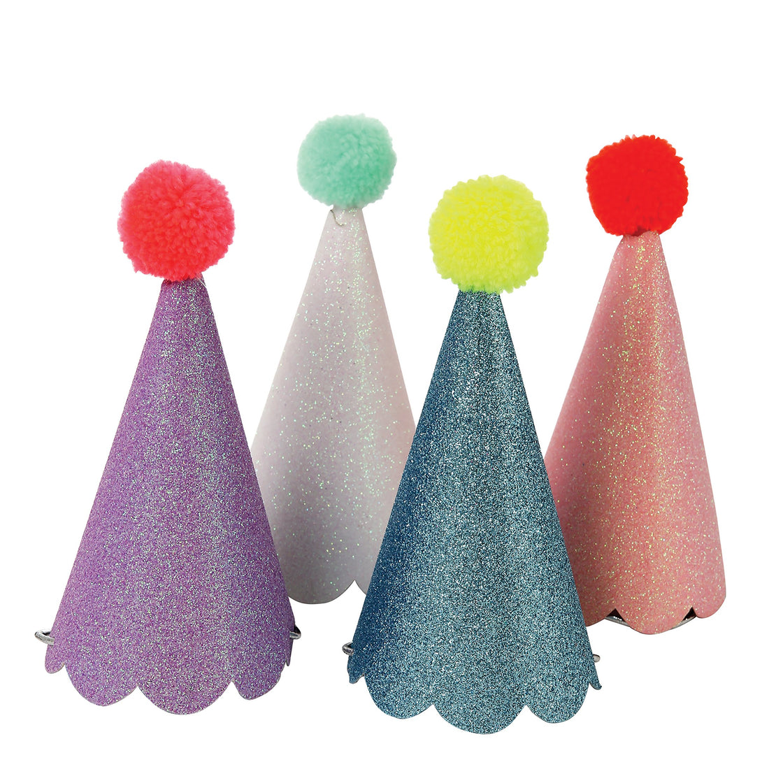 These fun hats are topped with colorful pompoms and covered with crystal glitter.