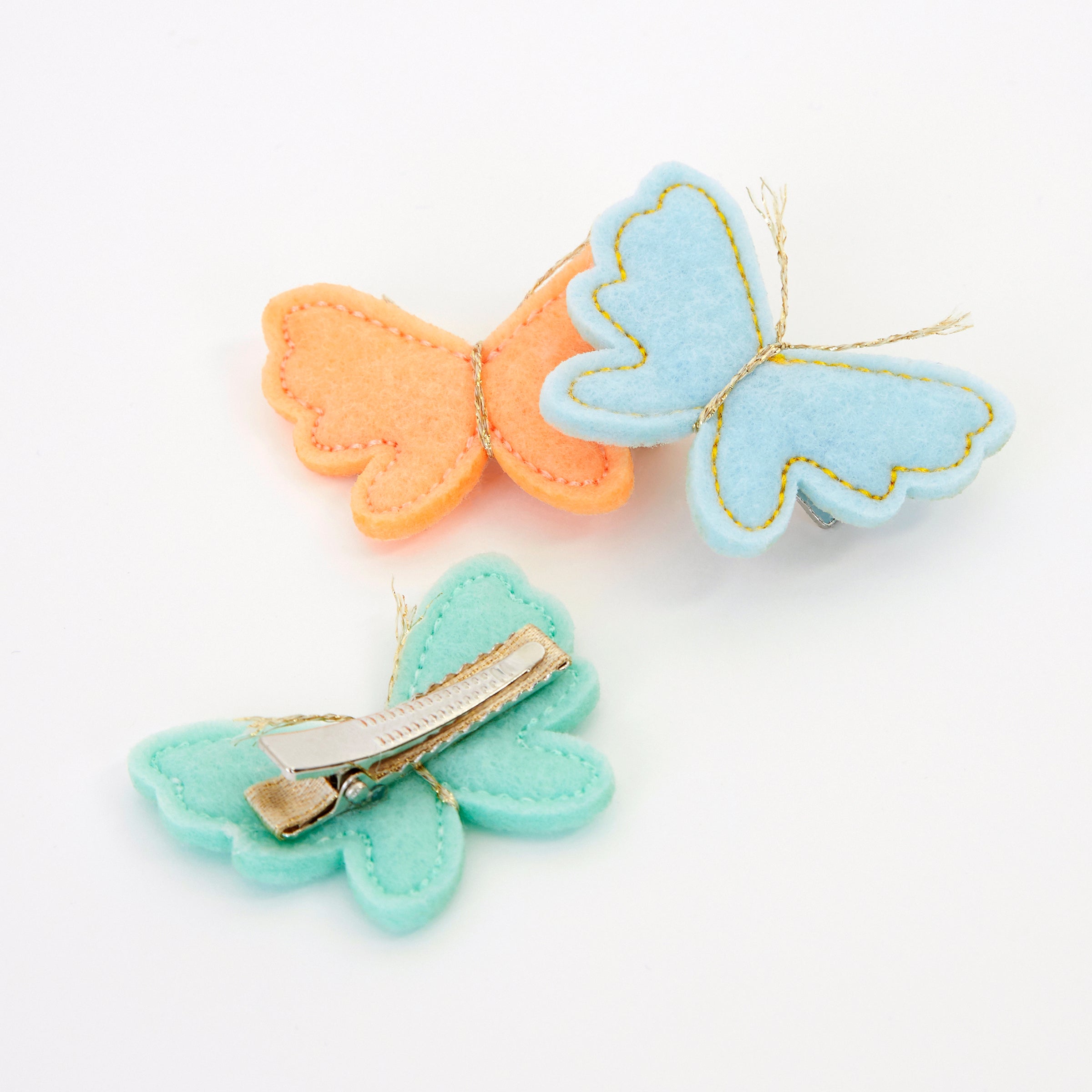 Our butterfly hair accessories are beautifully crafted from colorful felt with sweet metallic gold antennae.