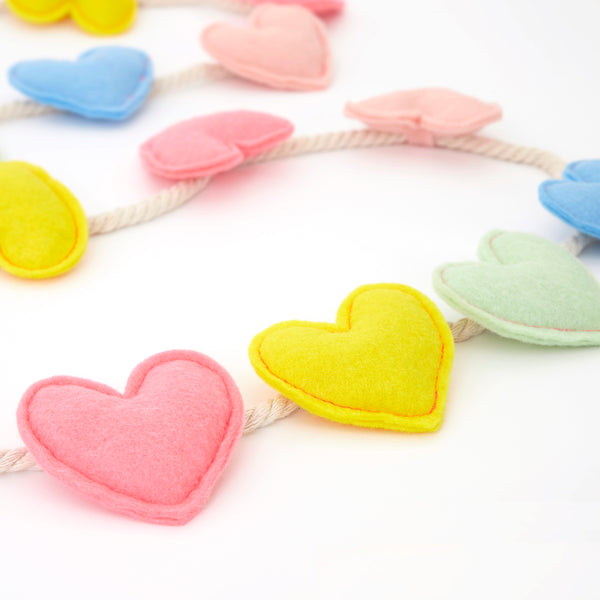 Our felt garland, featuring colorful hearts, is the perfect anniversary decoration or Valentine's Day decoration. Image3