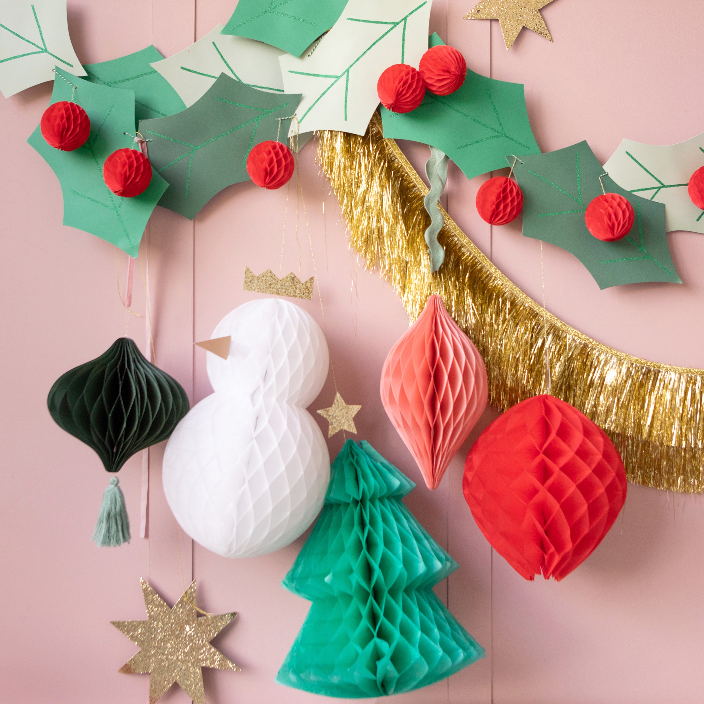 Our special paper garland features 3D holly berries and glittery leaves.
