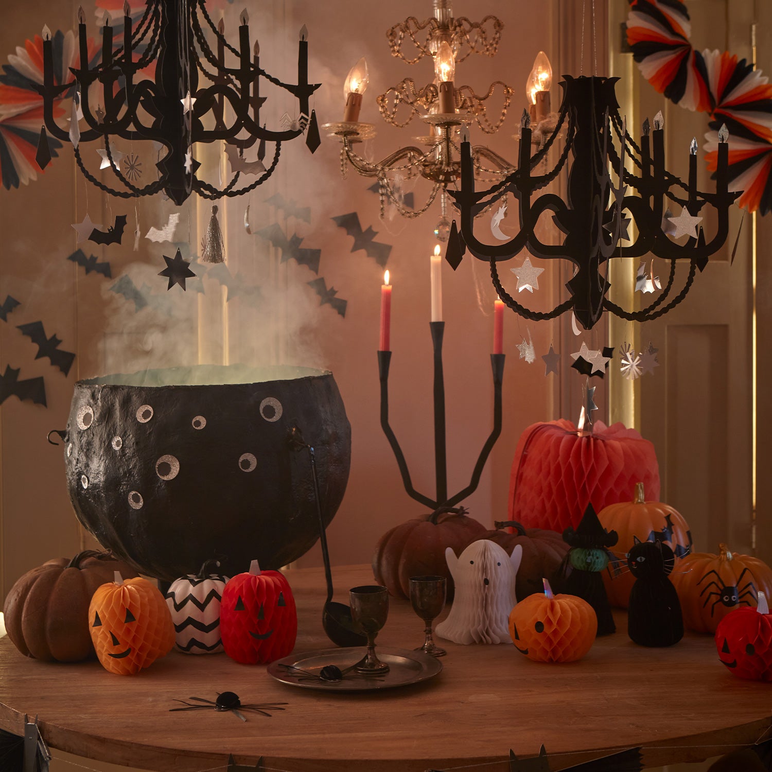 Our black chandelier, crafted from paper with shiny silver foil and 32 hanging decorations, is the perfect Halloween porch decoration.