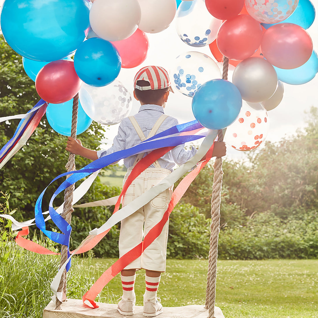 These fabulous 4th of July decorations are crafted from red, white, shiny silver and blue crepe paper streamers.