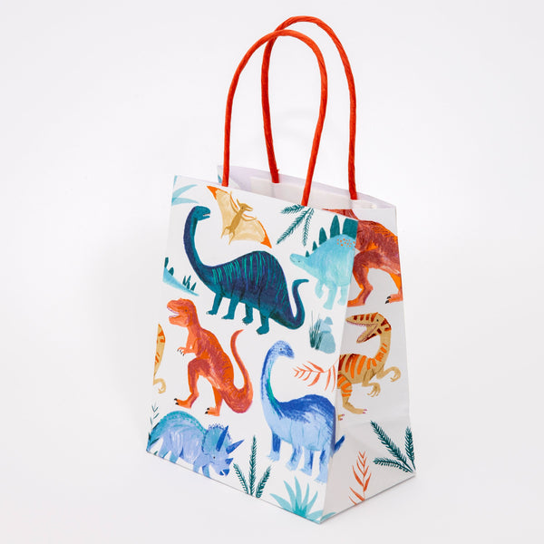Our colorful dinosaur goodie bags, with a twisted paper handle, look amazing. Image2