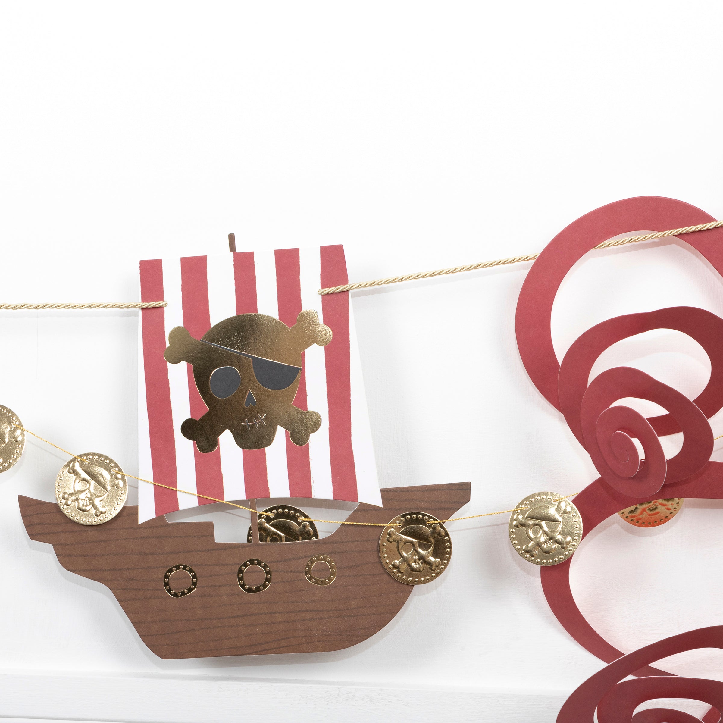 Our party garland is perfect for a pirate birthday party as it features pirate decorations including skull-and-crossbones and a pirate ship.