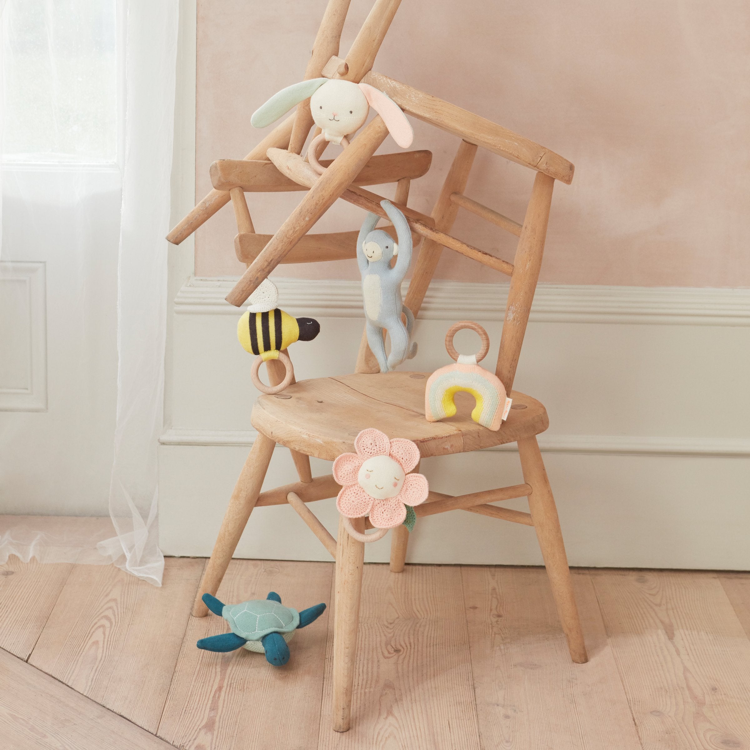 This monkey baby rattle is crafted from organic cotton, perfect as a newborn baby gift.