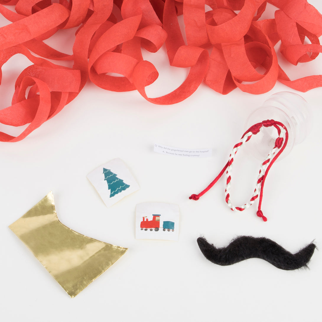 These are filled with gold party hats, friendship bracelets, jokes, stickers and self adhesive mustaches.
