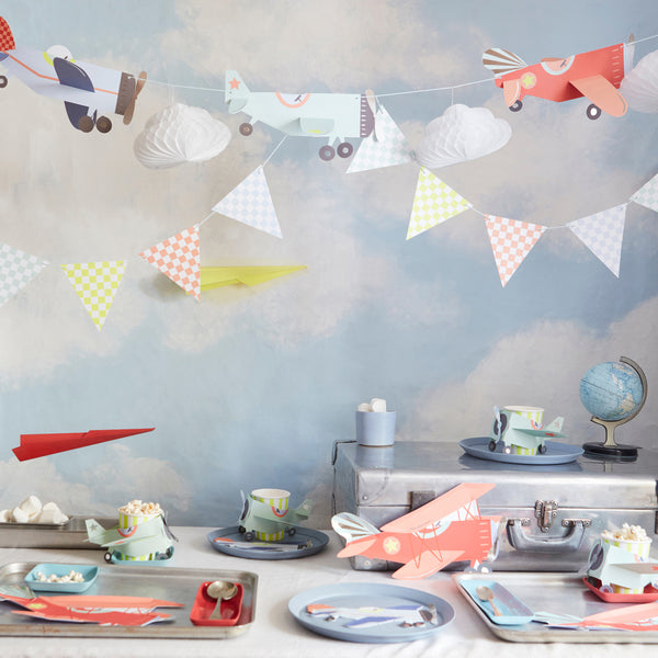 Kids who love airplanes will love our airplane party set which includes an airplane garland, plates, napkins and cups. Image2