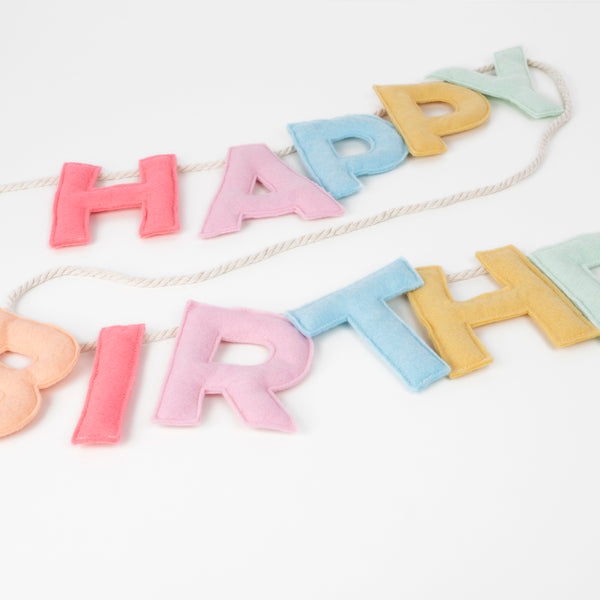 Add a rainbow of color to your birthday party supplies with a colorful felt garland, paper tablecloth and bright birthday cake candles. Image4