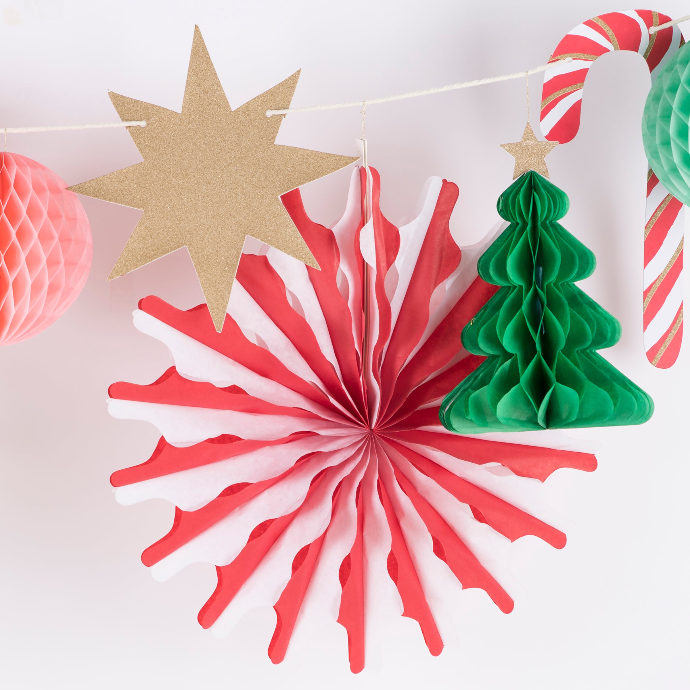 Our Christmas paper garland has 3D honeycomb decorations, stars and Christmas trees.