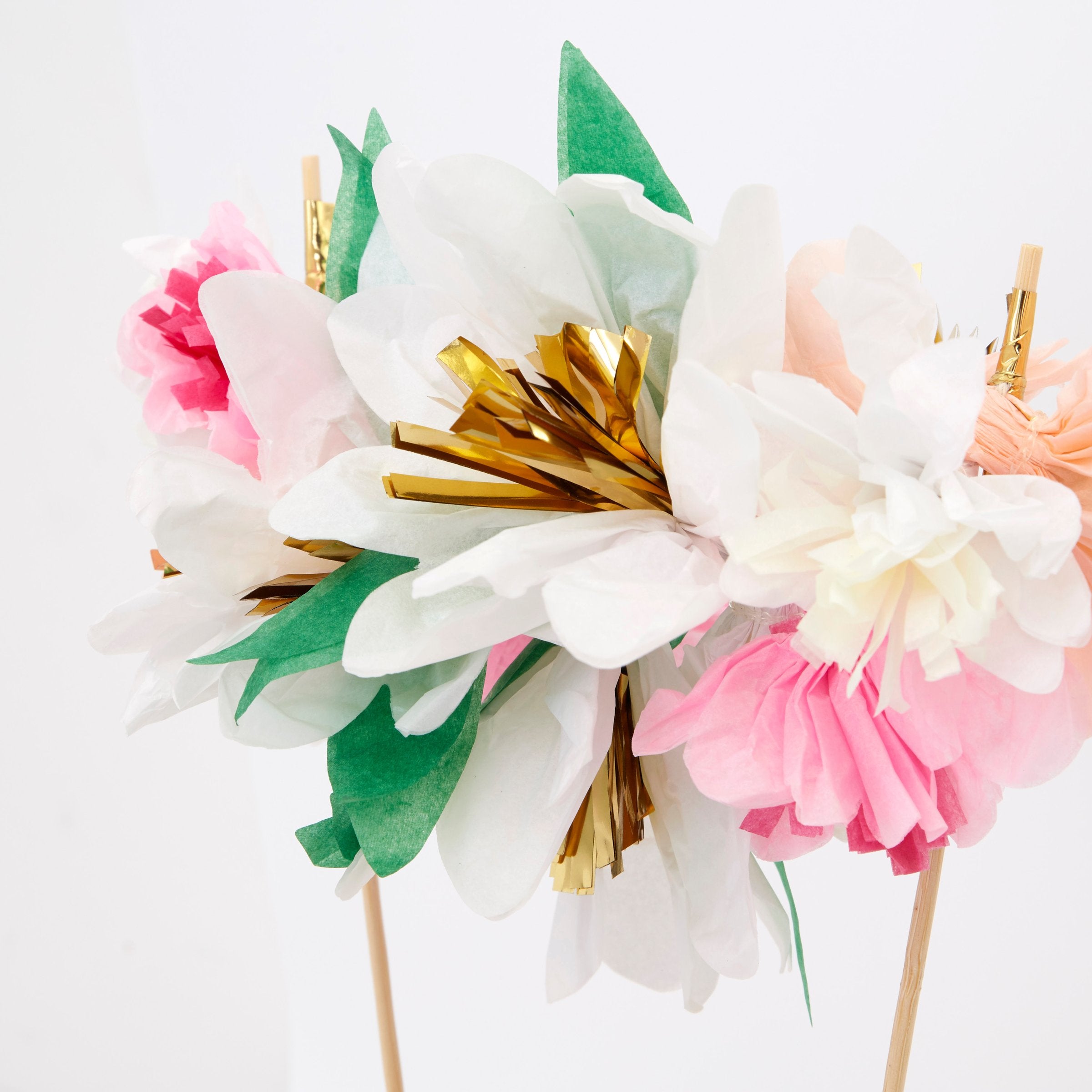 Turn a celebratory cake into a beautiful floral work of art with our fabulous cake topper crafted with colorful paper flowers.